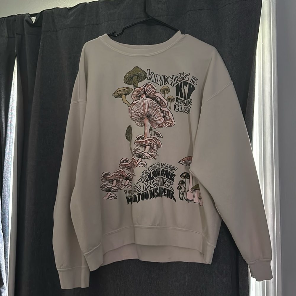 adorable sweater from urban outfitters. has mushrooms and cute little quotes.